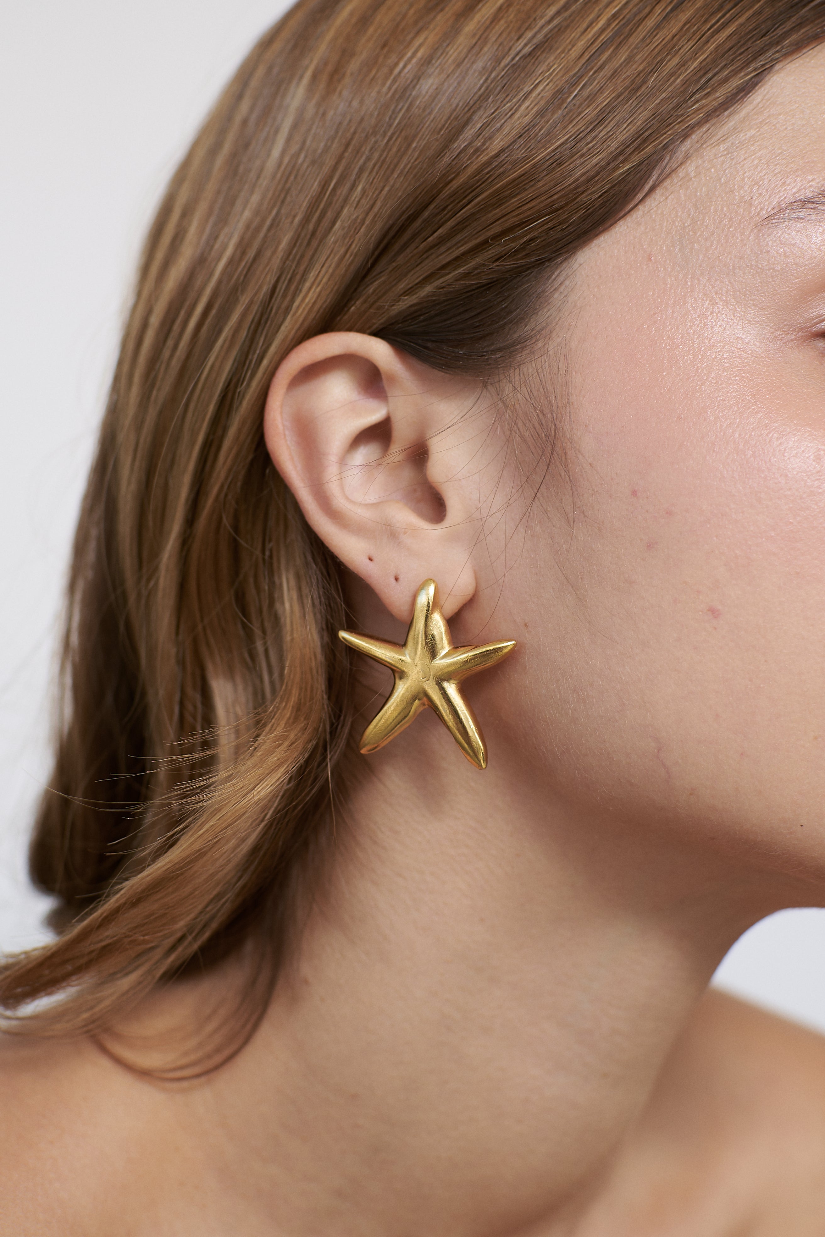 Aretes Una estrella de mar maxi dorado