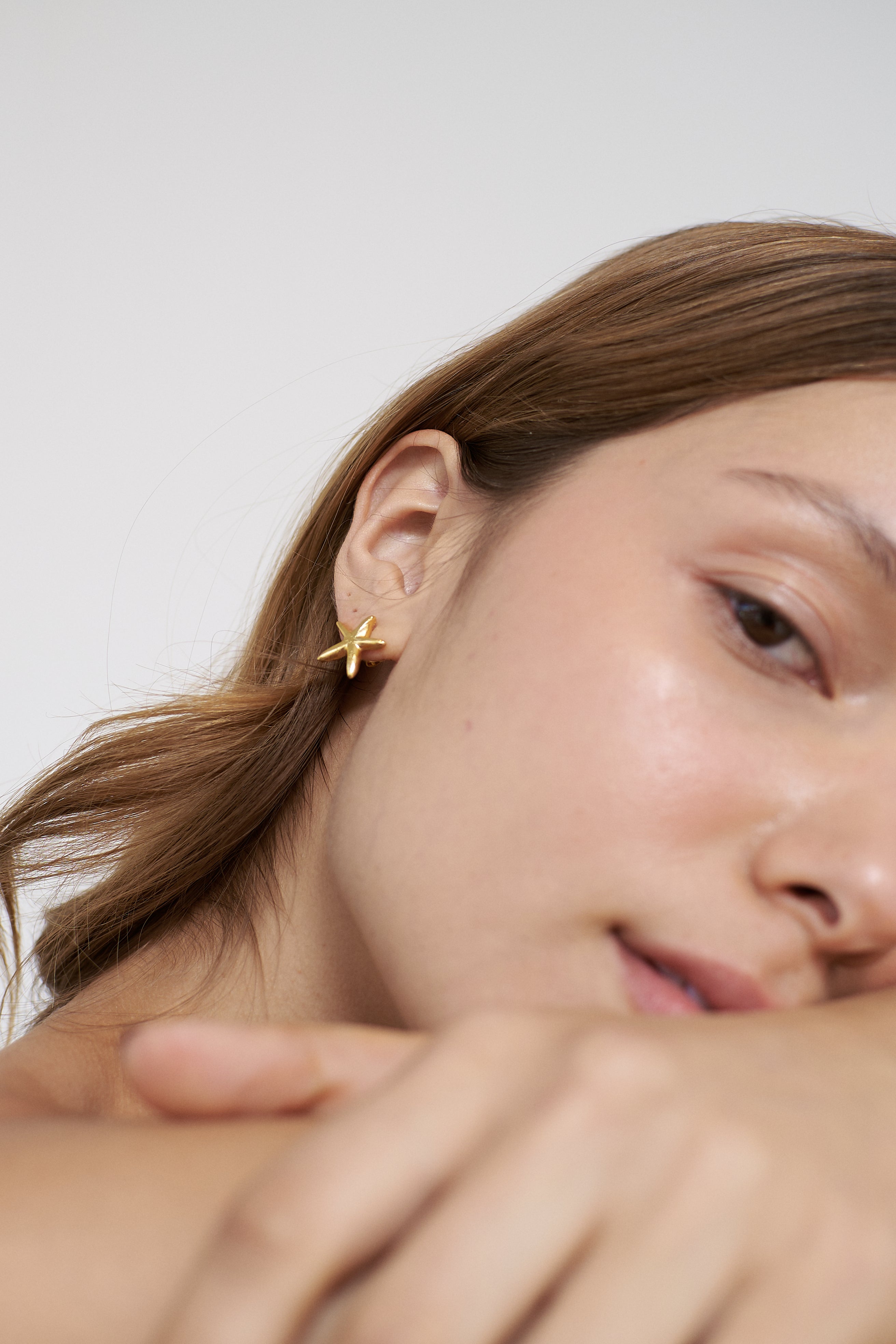 Aretes Una estrella de mar mini dorado